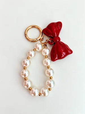 Pearl charm with red bow Pearl charm with red bow